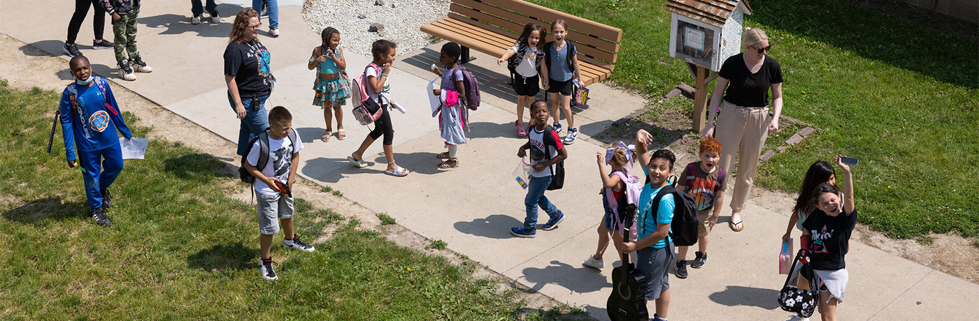 students walking on the sidewalk